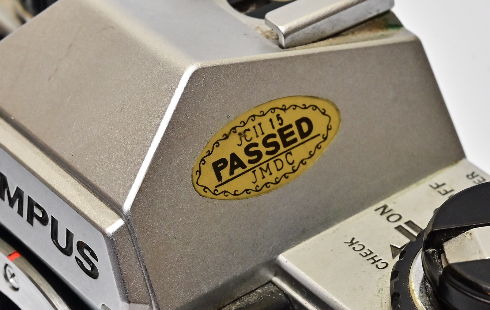 JMDC sticker on an Olympus OM10